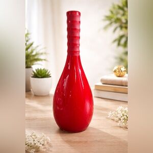 Mikasa Brentwood red glass vase, which features a tall neck genie bottle shape.